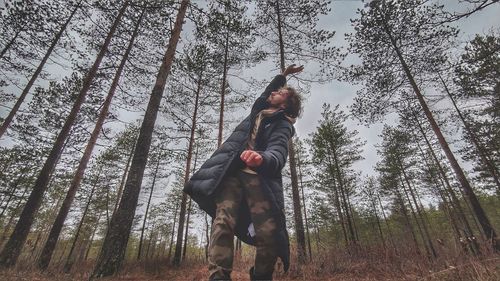 Low angle view of man in forest