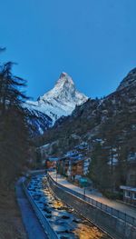 Snow covered mountain against clear sky