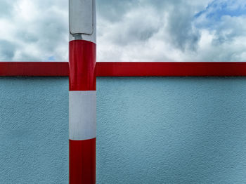 Close-up of red pipe against wall