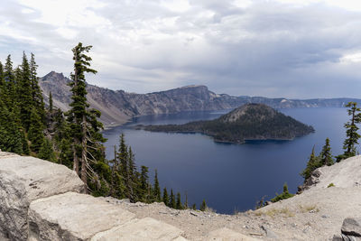 Panoramic view of snowcapped mountains against sky. crater lake national park, looking over a ledge