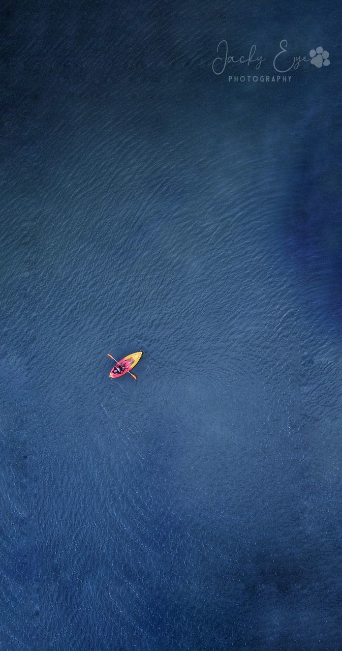 HIGH ANGLE VIEW OF NAUTICAL VESSEL IN SEA