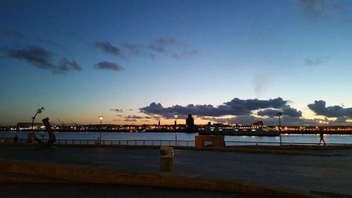 Pier in sea at dusk
