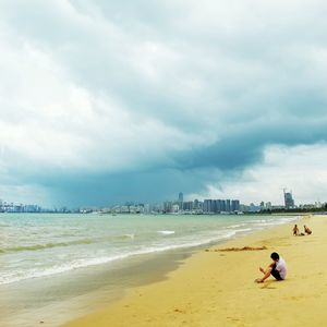 Full length of man on beach against sky