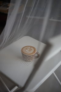 High angle view of coffee cup on table