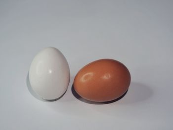 Close-up of eggs against white background