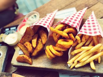 Close-up of fries with bread on table