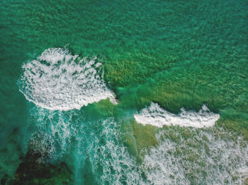 High angle view of water flowing in sea