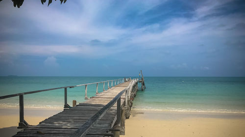 Pier over sea against sky