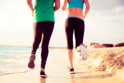 Low section of women on beach