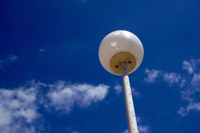 Low angle view of balloons against sky