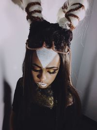 Close-up portrait of young woman in costume 