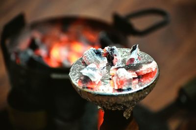 Close-up of burning coals on hookah