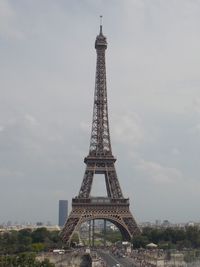 Communications tower against cloudy sky