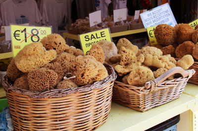 Various fruits in basket for sale at market stall