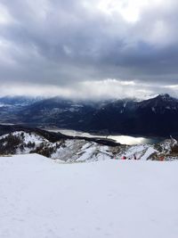 Scenic view of mountains against sky during winter