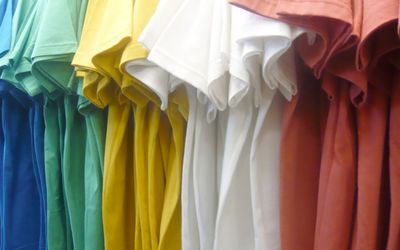 Full frame shot of multi colored t-shirts in store