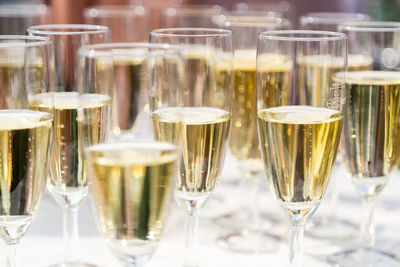 Close-up of wine glasses on table