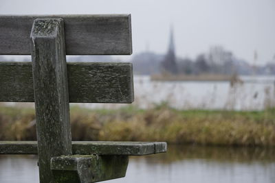 Close-up of wooden structure against lake