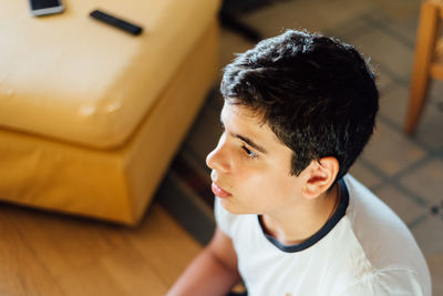 High angle view of boy looking at home