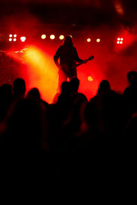 Silhouette people at music concert