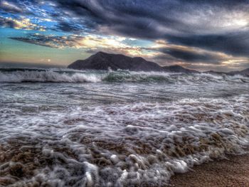 Scenic view of sea against dramatic sky