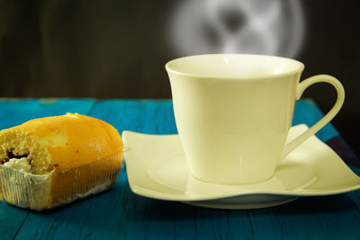 Close-up of coffee cup on table