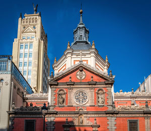 Low angle view of building against blue sky