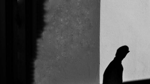 Low section of person standing on wall