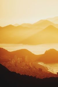 Scenic view of mountains against sky during sunset