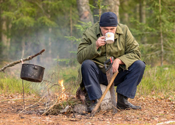 Portrait of senior man working in forest