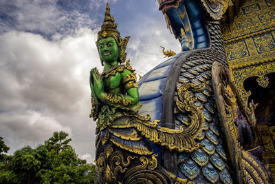 Low angle view of statue against building