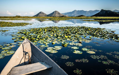 Scenic view of lake with mountains in background