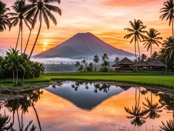 Scenic view of lake against sky during sunset