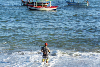 Rear view of man on beach