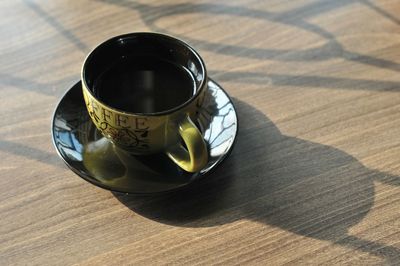 High angle view of coffee cup on table