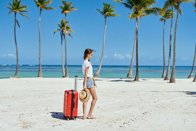 Full length of young woman on beach