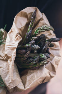 High angle view of dried leaves on paper