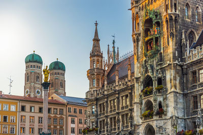 Low angle view of buildings against sky in city