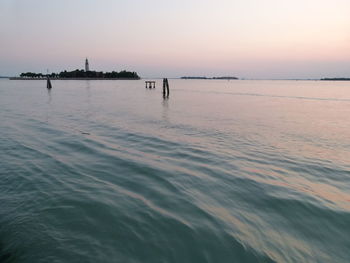 Scenic view of sea against orange sky