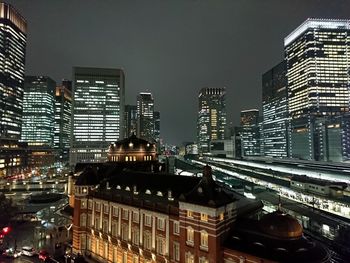 Low angle view of skyscrapers lit up at night