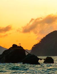Scenic view of sea against sky during sunset