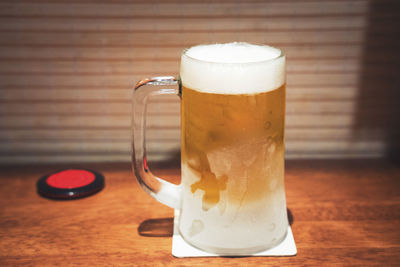 Close-up of beer glass on table