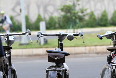 Old bicycles lined up neatly on the side of the road, bintaro