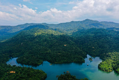 Scenic view of lake and mountains against sky