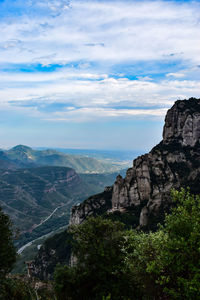 Scenic view of landscape against cloudy sky