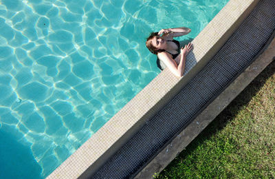 High angle view of man swimming in pool