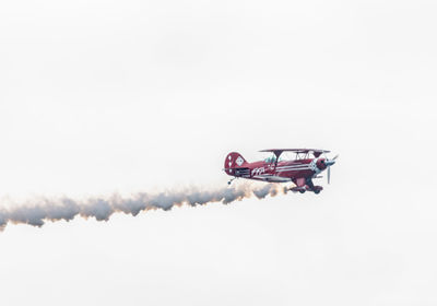 Airplane flying against sky