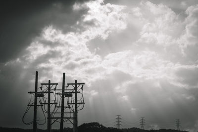 Low angle view of communications tower against sky