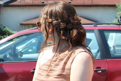 Close-up of woman in front of car