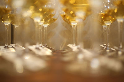 Close-up of wineglasses on table